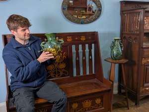 Cataloguer Barnaby Willis with examples of Brannam Pottery and Shapland and Petter